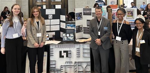 Students with Teacher and Trifold at the Showcase